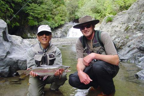 Big Dan and happy customer with trout