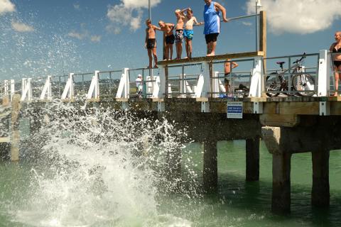 Kids jumping off wharf