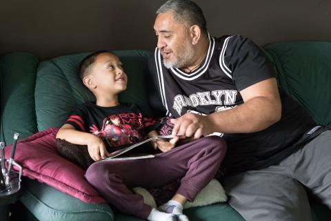 Kid being read to